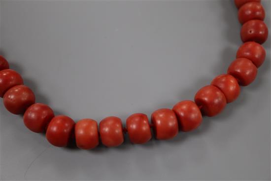 A single strand coral bead necklace, with gilt metal clasp, 47cm, gross weight 64 grams.